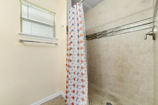 a bathroom with a shower curtain