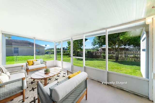 a view of pool with porch and outdoor seating
