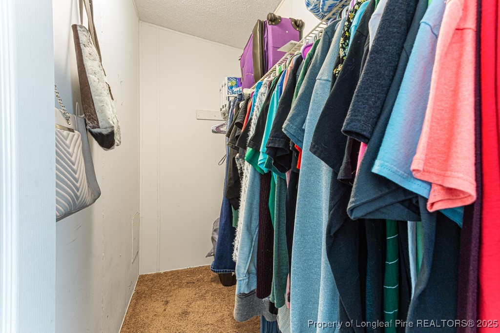 152 Rocks Edge Lane Smithfield, NC 27577 - Photo 25 of 32 Master bedroom walk in closet