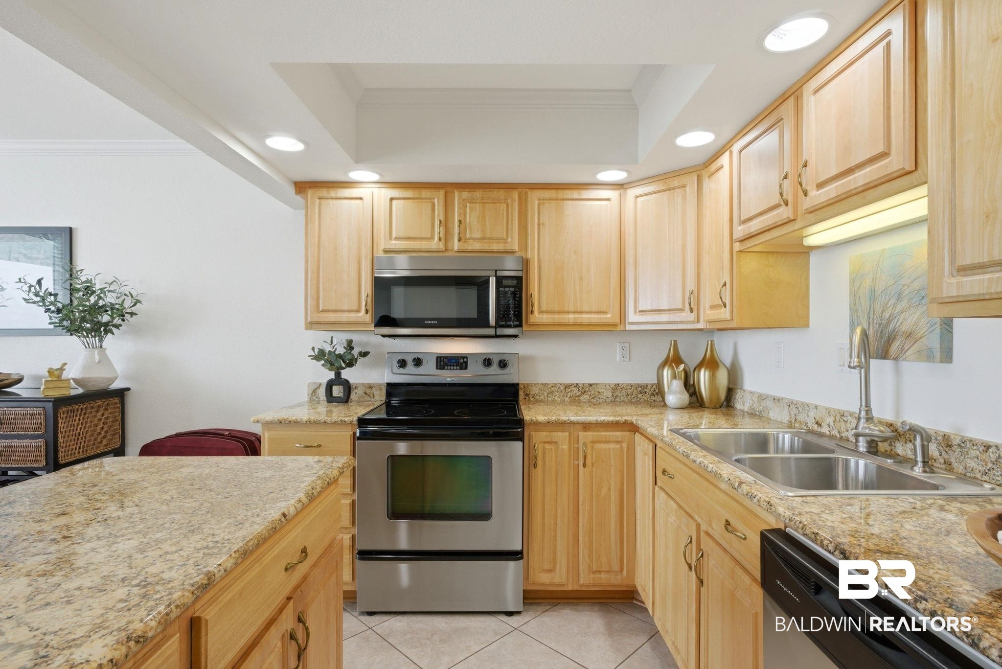 16284 Perdido Key Drive, Unit 912 Perdido Key, FL 32507 - Photo 29 of 49 Kitchen featuring ornamental molding, stainless steel appliances, light wood finish cabinets, recessed lighting, and light stone countertops