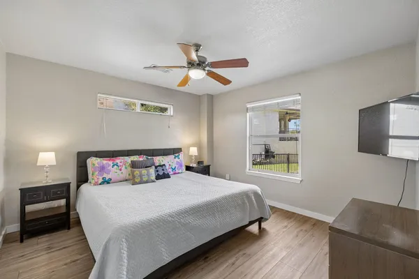 a bedroom with a bed and a window