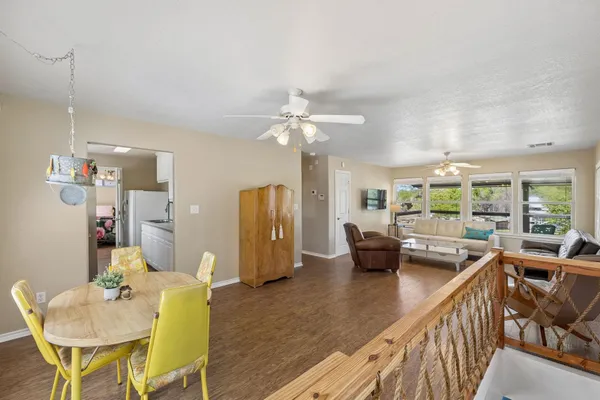 a view of a dining room with furniture window and outside view