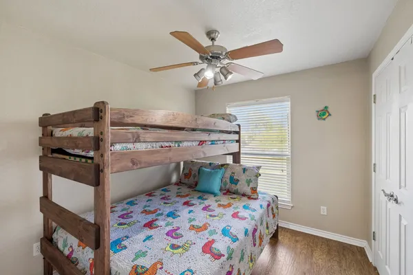 a bed room with a bed and a chandelier