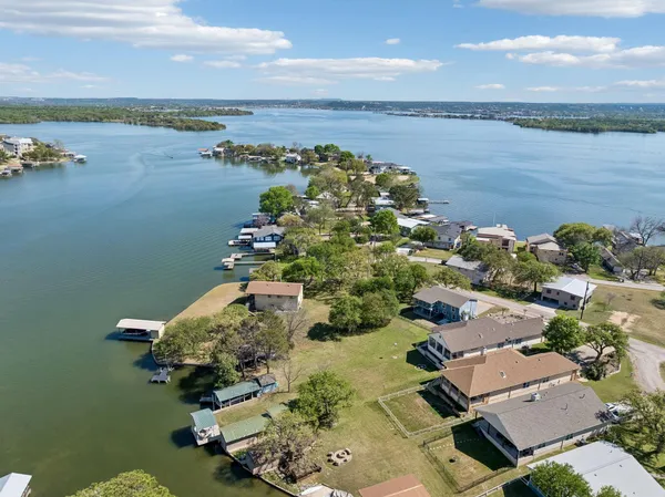an aerial view of a house with a lake view