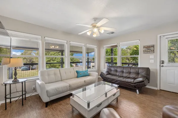 a living room with furniture and a large window