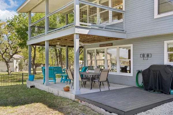 a view of a house with backyard and porch