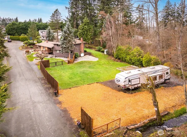 an aerial view of a house with outdoor space