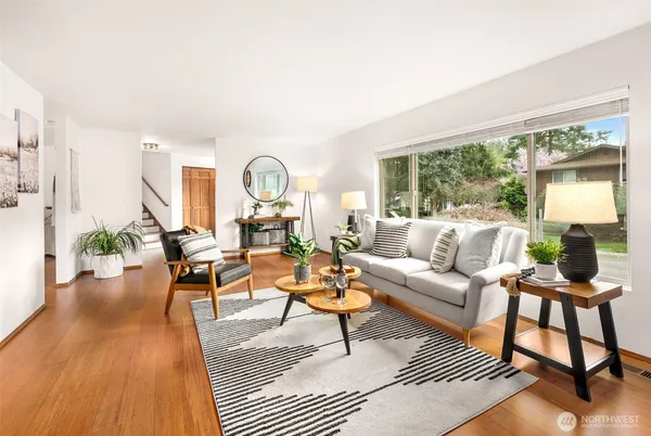a living room with furniture and a large window