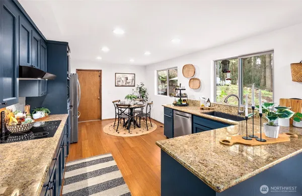a view of a dining room with furniture and a kitchen counter top