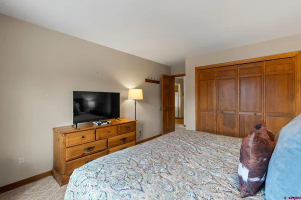 a bedroom with a bed and television