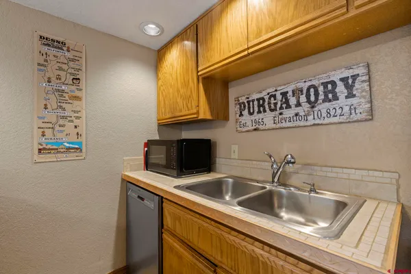 a kitchen with a sink and cabinets