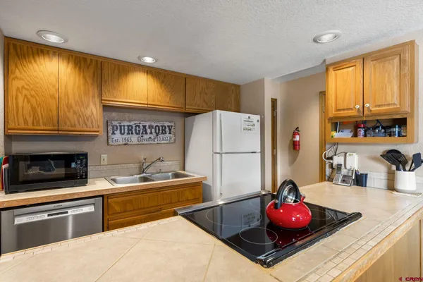 a kitchen with cabinets and window