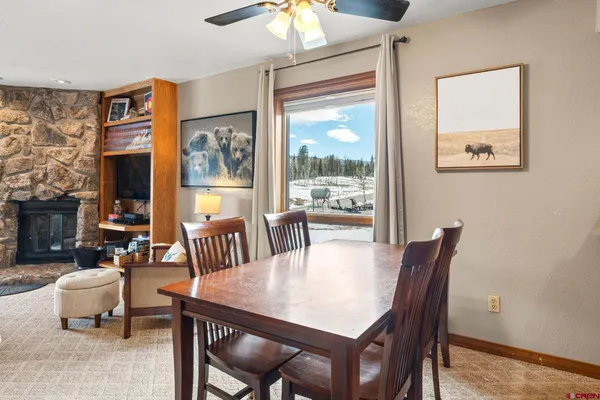 a view of a dining room with furniture window and outside view