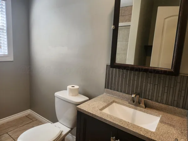 a bathroom with a sink and a toilet