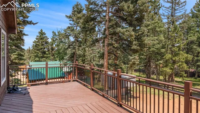 a view of a balcony with wooden floor