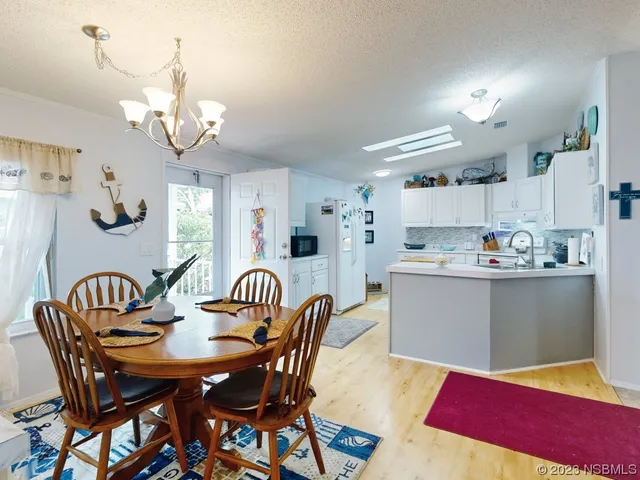 a kitchen with stainless steel appliances a sink and cabinets