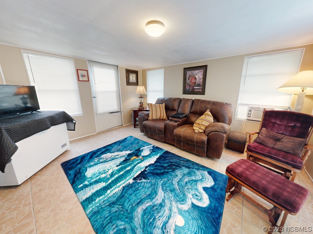 613 Portside Lane Edgewater, FL 32141 - Photo 21 of 49 a living room with furniture and a couch