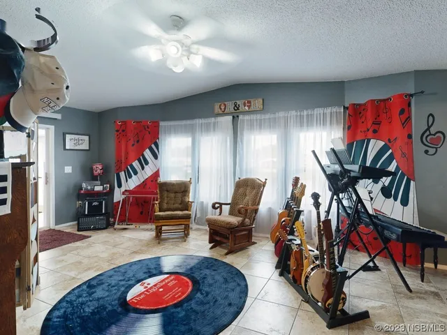 a room with furniture and gym equipment