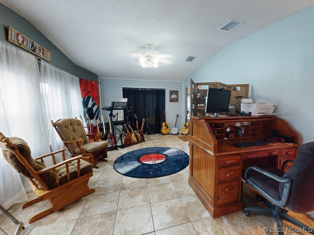 613 Portside Lane Edgewater, FL 32141 - Photo 25 of 49 a room with furniture and gym equipment