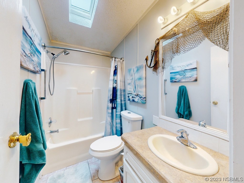 613 Portside Lane Edgewater, FL 32141 - Photo 26 of 49 a bathroom with a sink toilet and shower