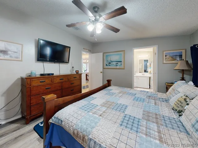 a spacious bathroom with a sink and mirror