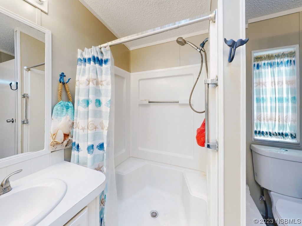 613 Portside Lane Edgewater, FL 32141 - Photo 32 of 49 a bathroom with a sink and a shower