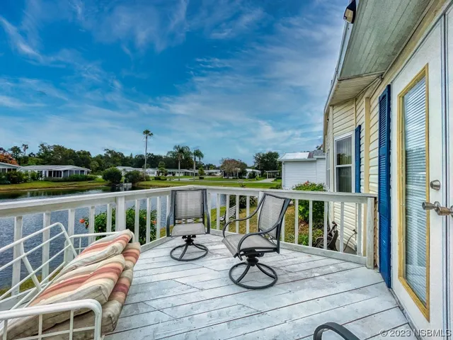 a view of roof deck with lounge chair and barbeque oven