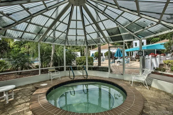 a view of swimming pool from a balcony