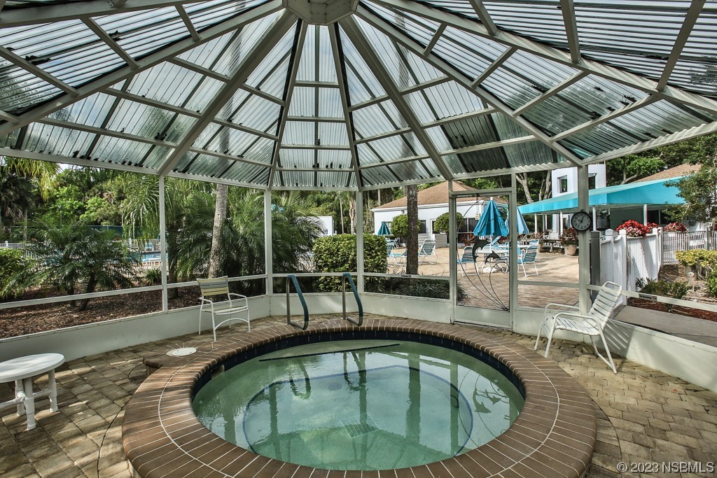 613 Portside Lane Edgewater, FL 32141 - Photo 38 of 49 a view of a swimming pool with a patio