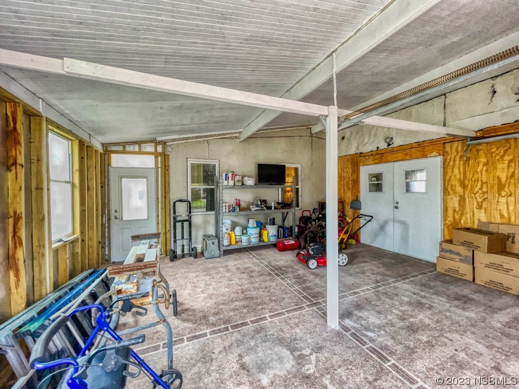 613 Portside Lane Edgewater, FL 32141 - Photo 9 of 49 a view of a room with gym equipment