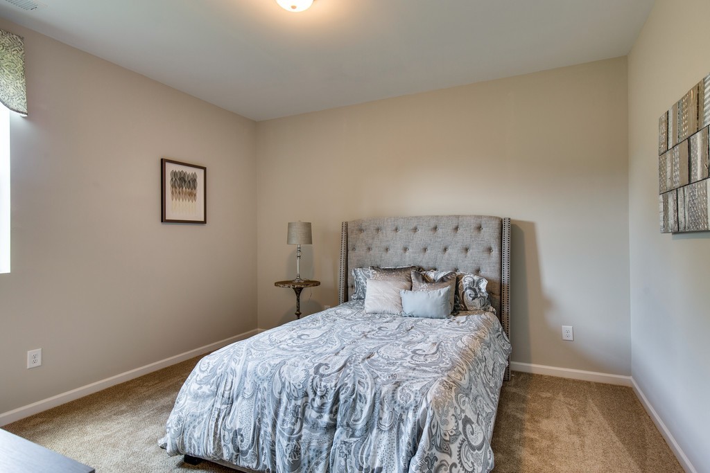 3910 Hon Circle Murfreesboro, TN 37128 - Photo 23 of 25 a bedroom with a bed and a window