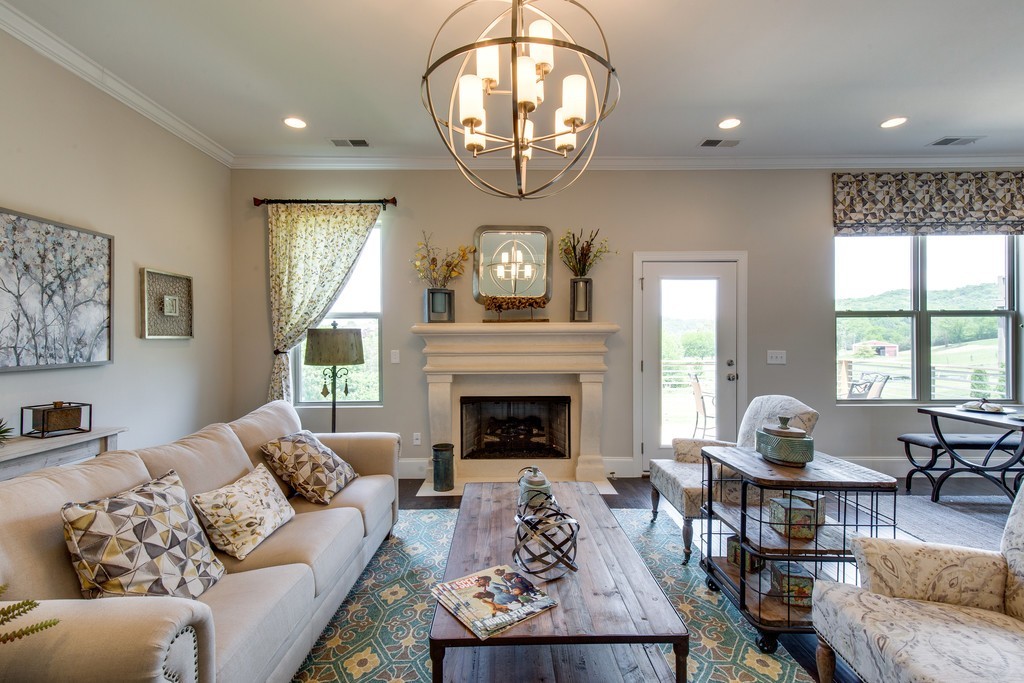 3910 Hon Circle Murfreesboro, TN 37128 - Photo 10 of 25 a living room with furniture a fireplace and a large window