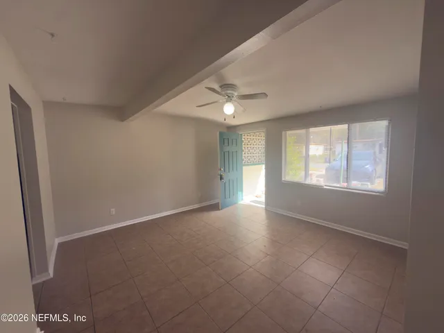 a view of an empty room with a window