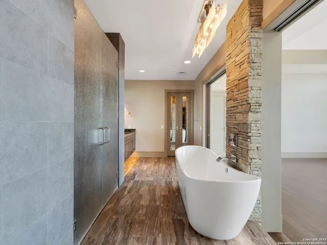 a bathroom with a bathtub and shower