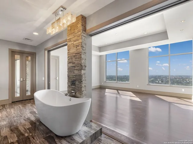 a bathroom with a bathtub and shower