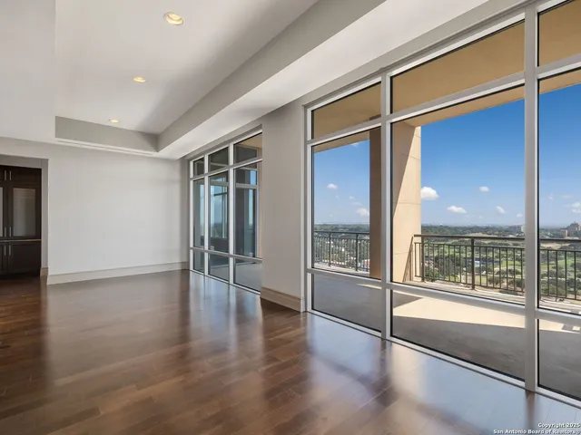 a view of an entryway with wooden floor