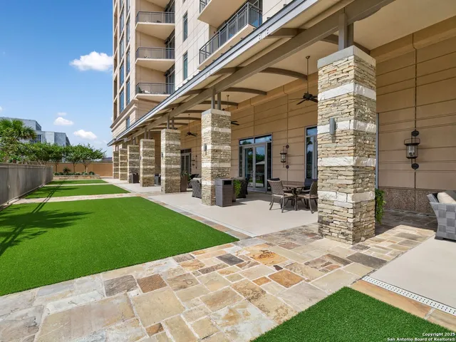 a view of a swimming pool with a patio