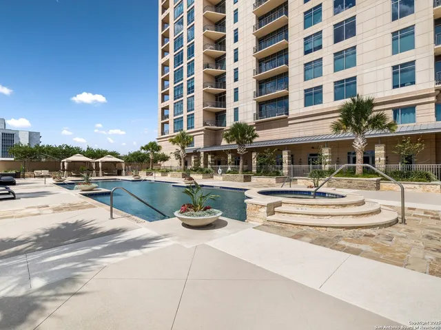 a living room with lots of furniture and a flat screen tv