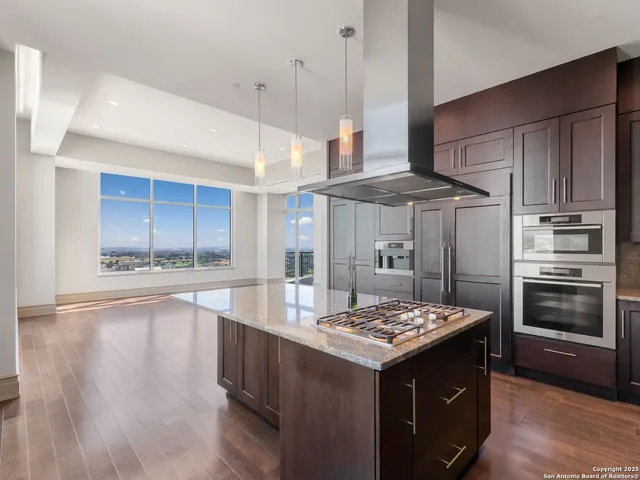 a kitchen with a sink stove and refrigerator