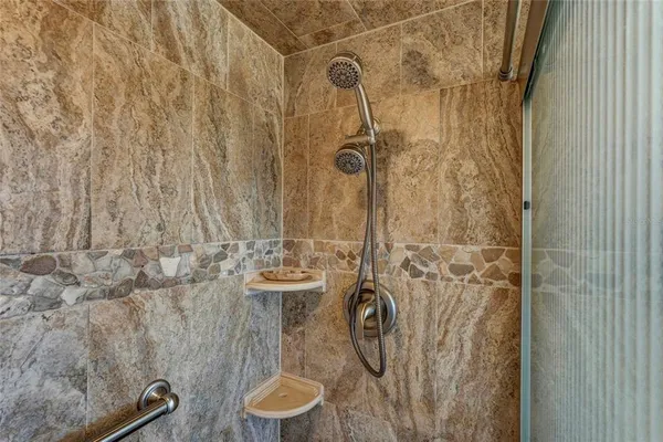 a bathroom with a shower curtain and a sink