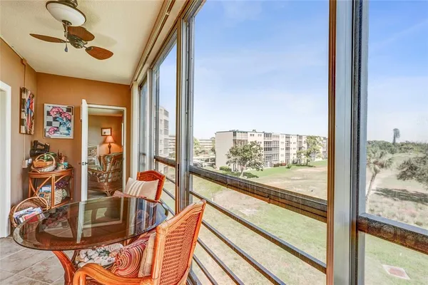 a view of a living room and floor to ceiling window or couch