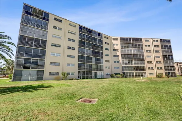 a view of building with yard