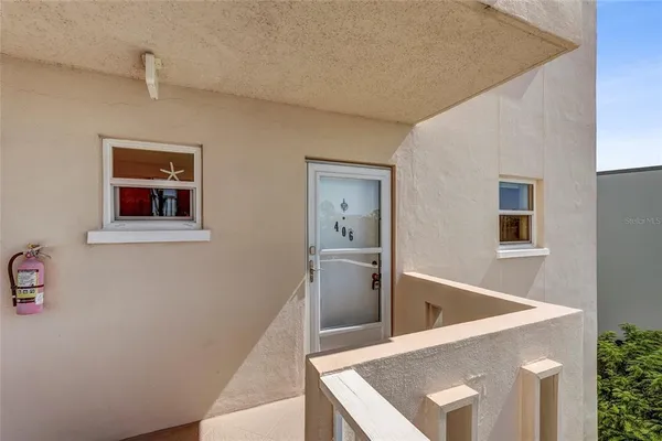 a view of a hallway with an entryway