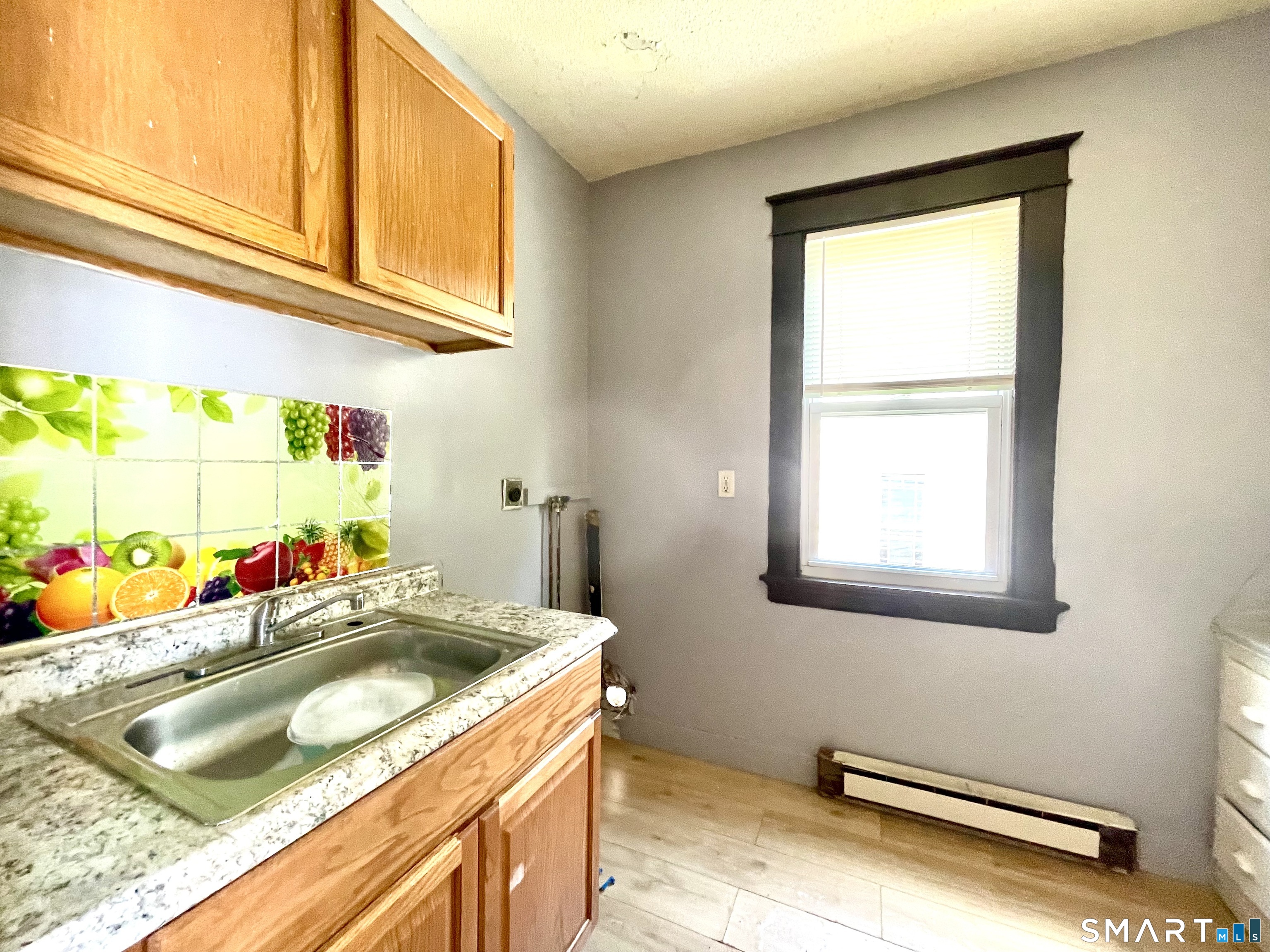 146 Charles Street, Unit 3 Waterbury, CT 06708 - Photo 12 of 20 a bathroom with a sink and a window