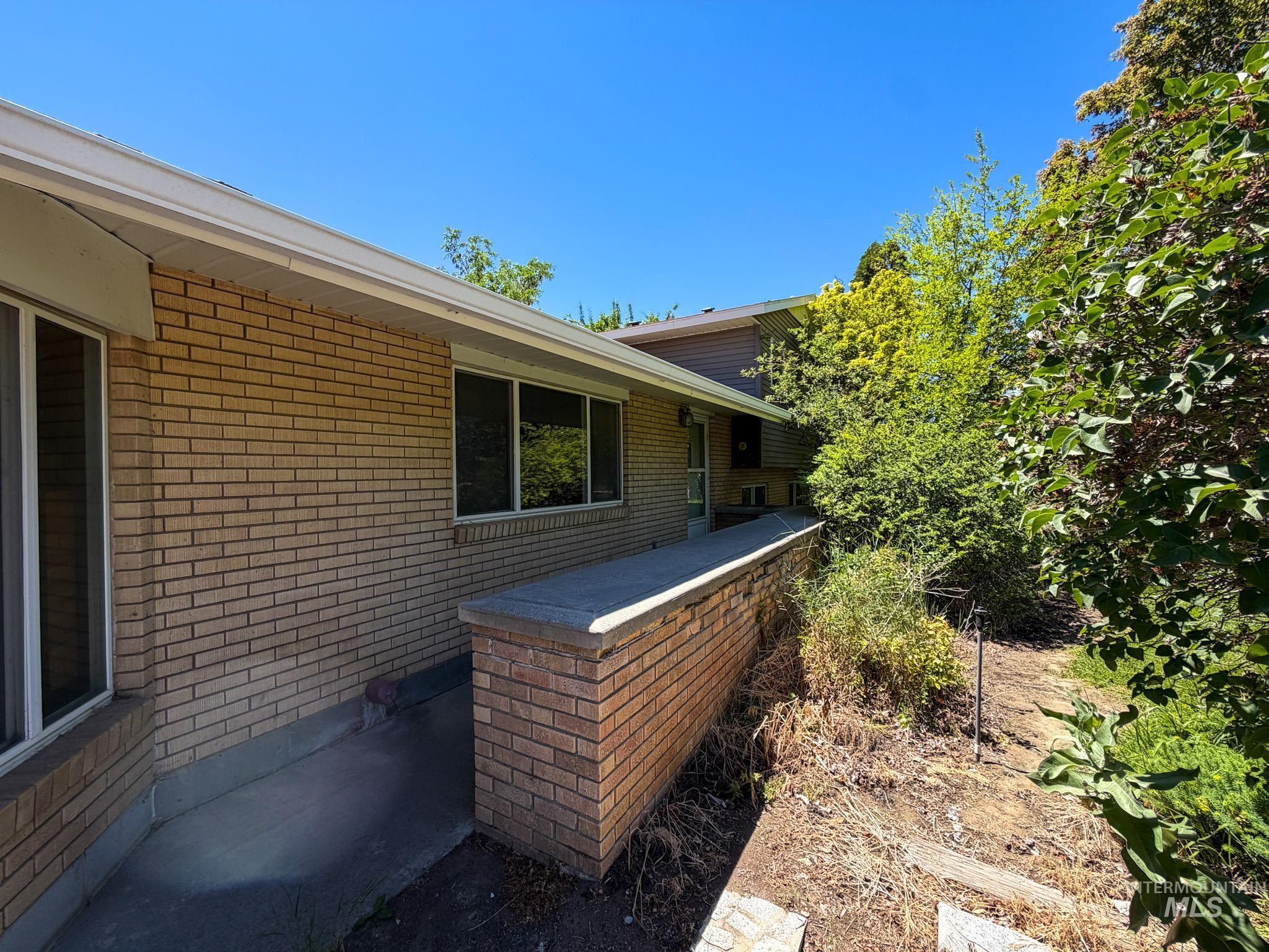 1924 H Street Rupert, ID 83350 - Photo 13 of 13 Brick exterior with white soffits and fascia