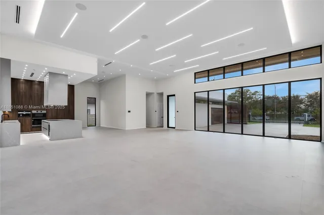 a view of kitchen and living room with windows