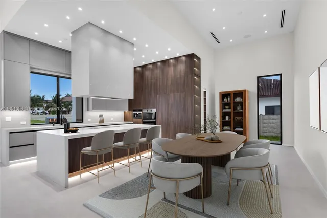 a kitchen that has a sink and a stove