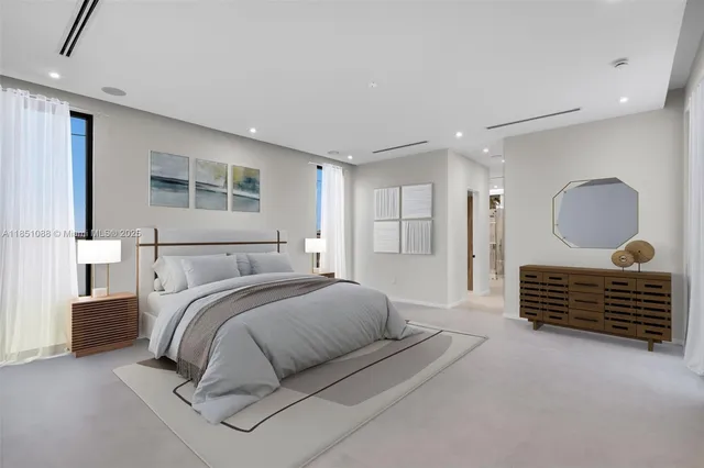 a kitchen with stainless steel appliances granite countertop a sink and a refrigerator
