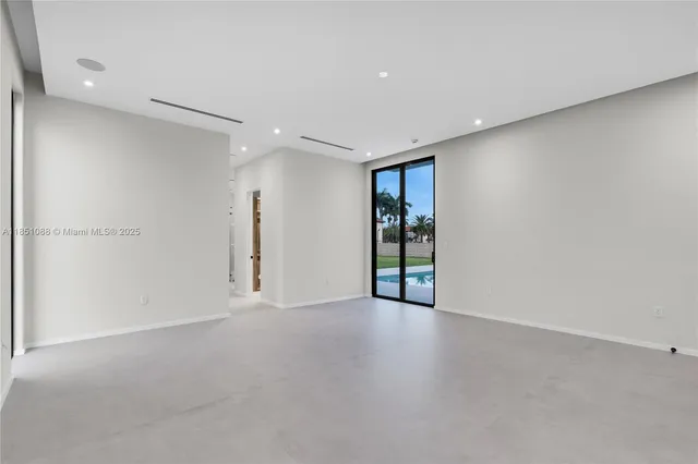 a kitchen with stainless steel appliances granite countertop a sink and a stove