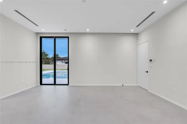 a view of a living room and kitchen